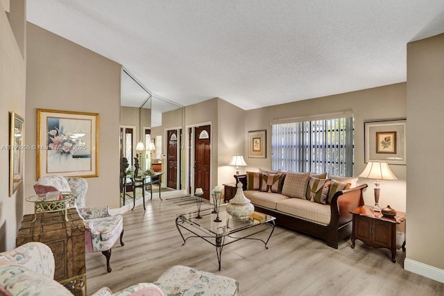 1930 W Oak Knoll Cir, Davie, FL 33324 - living area featuring wood finished floors, baseboards, vaulted ceiling, and a textured ceiling