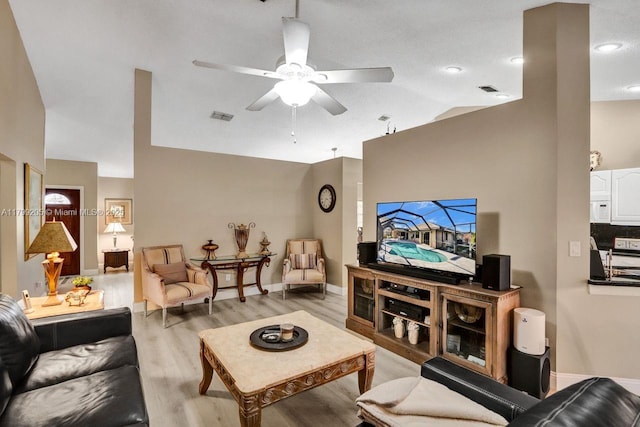 1930 W Oak Knoll Cir, Davie, FL 33324 - living room featuring a ceiling fan, lofted ceiling, light wood-style flooring, and baseboards