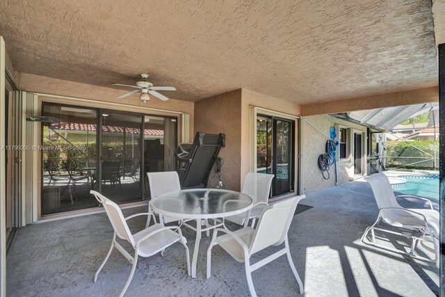 1930 W Oak Knoll Cir, Davie, FL 33324 - view of patio / terrace with a ceiling fan, glass enclosure, an outdoor pool, and outdoor dining area
