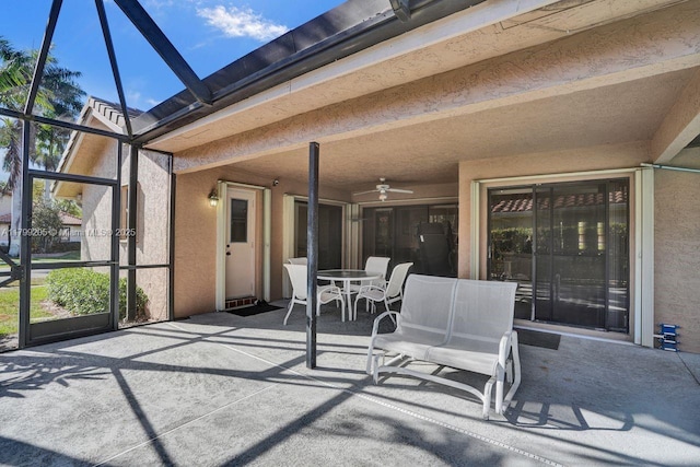 1930 W Oak Knoll Cir, Davie, FL 33324 - view of patio featuring glass enclosure, a ceiling fan, and outdoor dining space
