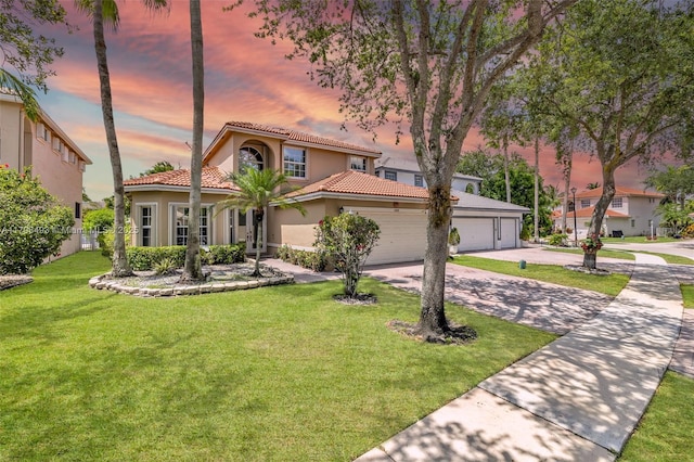 11919 NW 47th St, Coral Springs, FL 33076 - mediterranean / spanish home featuring driveway, stucco siding, a tile roof, a front lawn, and a garage