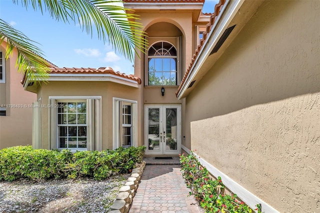 11919 NW 47th St, Coral Springs, FL 33076 - entrance to property featuring french doors, stucco siding, and a tile roof