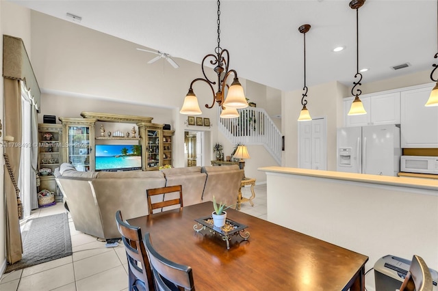 11919 NW 47th St, Coral Springs, FL 33076 - dining room featuring light tile patterned floors, a ceiling fan, stairs, recessed lighting, and a high ceiling