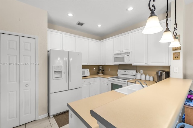11919 NW 47th St, Coral Springs, FL 33076 - kitchen featuring white appliances, a peninsula, light tile patterned floors, white cabinets, and recessed lighting