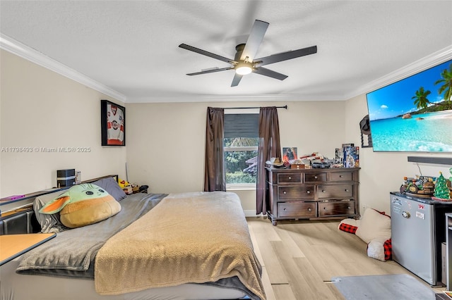 11919 NW 47th St, Coral Springs, FL 33076 - bedroom featuring crown molding, light wood-style flooring, freestanding refrigerator, ceiling fan, and a textured ceiling