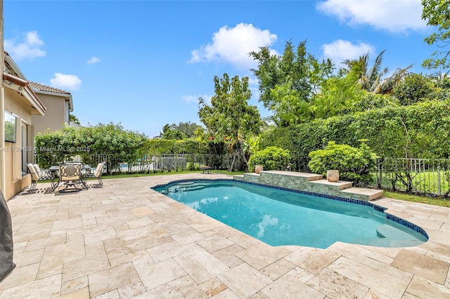 11919 NW 47th St, Coral Springs, FL 33076 - view of swimming pool with a patio, a fenced backyard, and view of scattered trees