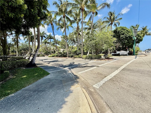 4855 Palmbrooke Cir, West Palm Beach, FL 33417 - view of asphalt road featuring sidewalks and curbs