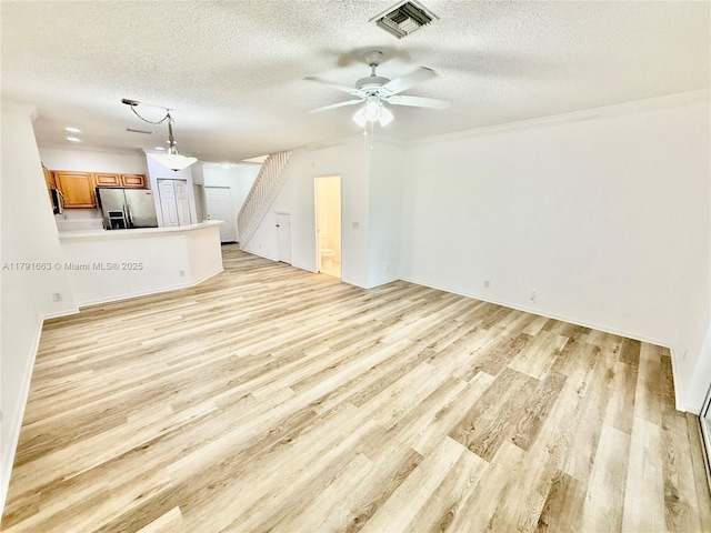 4855 Palmbrooke Cir, West Palm Beach, FL 33417 - unfurnished living room featuring a textured ceiling, light wood finished floors, a ceiling fan, ornamental molding, and baseboards