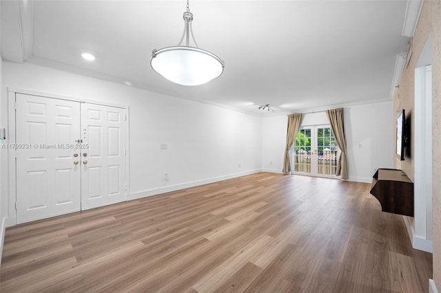 1400 Salzedo St Unit 208, Coral Gables, FL 33134 - unfurnished living room featuring light wood-style floors, ornamental molding, and recessed lighting