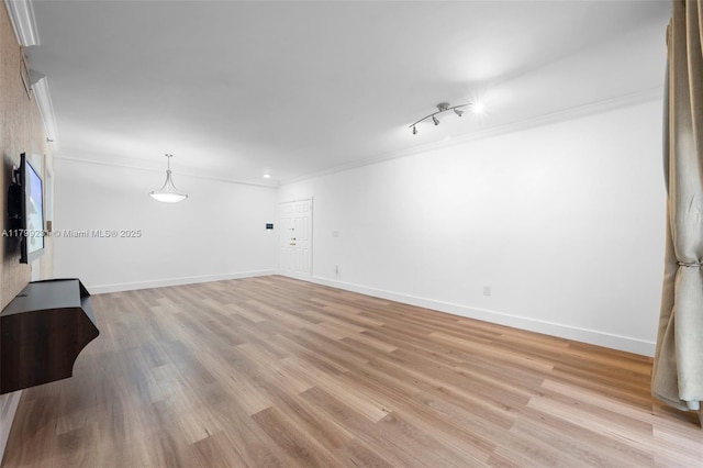 1400 Salzedo St Unit 208, Coral Gables, FL 33134 - unfurnished living room with crown molding and light wood-style flooring