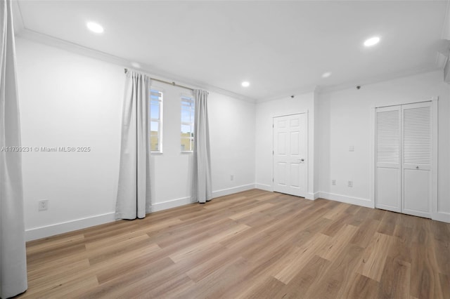 1400 Salzedo St Unit 208, Coral Gables, FL 33134 - unfurnished bedroom with crown molding, light wood-type flooring, and recessed lighting