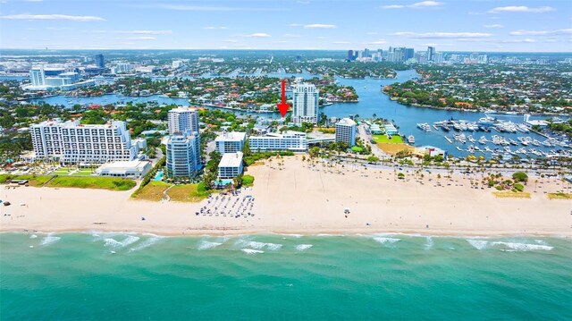 view of urban area with waterfront with a beach