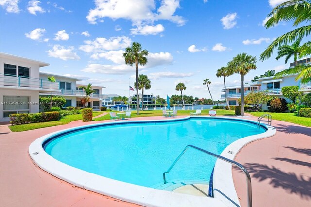 community pool with a lawn