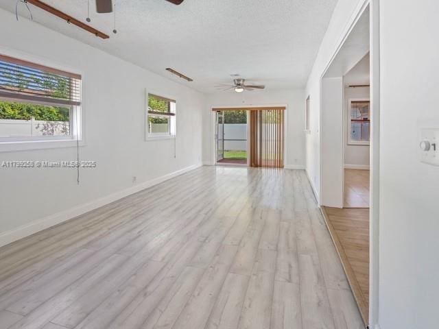 2650 NW 67th Ter, Margate, FL 33063 - unfurnished room with ceiling fan, light wood-type flooring, and a textured ceiling