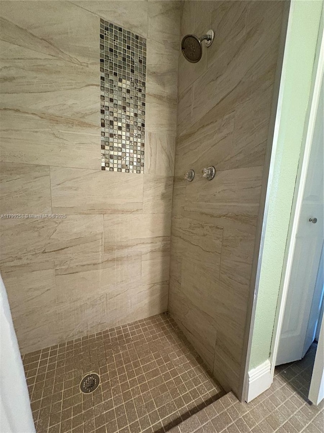 2650 NW 67th Ter, Margate, FL 33063 - bathroom featuring a tile shower and tile patterned floors