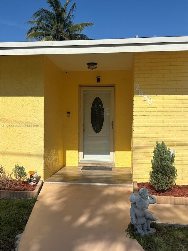 2650 NW 67th Ter, Margate, FL 33063 - view of exterior entry featuring stucco siding and brick siding