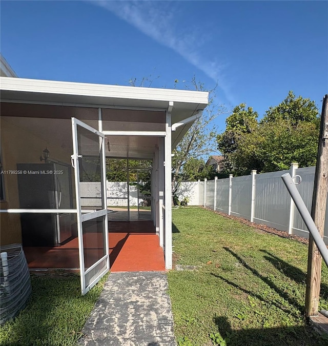 2650 NW 67th Ter, Margate, FL 33063 - fenced backyard with a sunroom