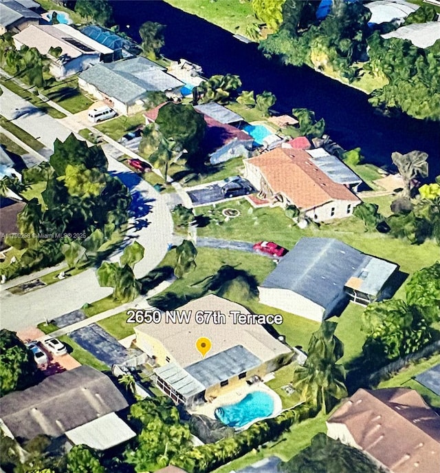 2650 NW 67th Ter, Margate, FL 33063 - aerial view of property's location featuring a pool and nearby suburban area
