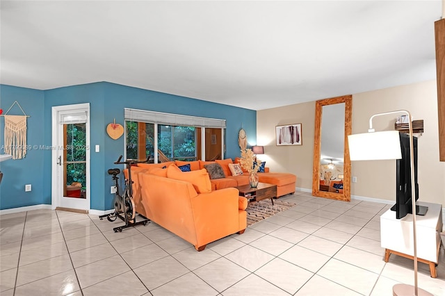 living area with light tile patterned flooring and baseboards