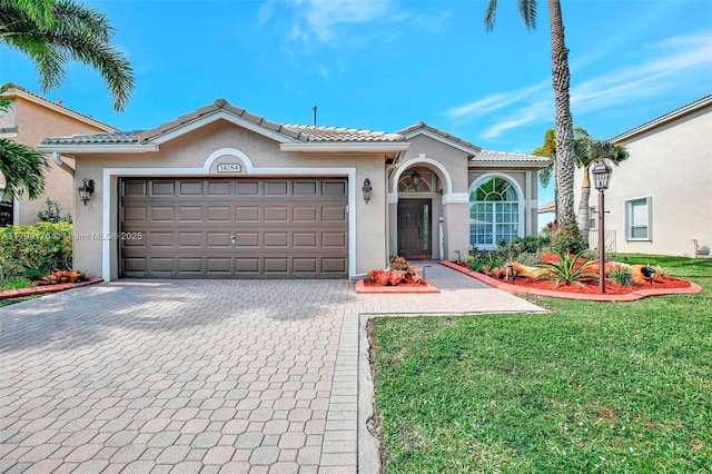 14284 NW 18th Mnr, Pembroke Pines, FL 33028 - mediterranean / spanish-style home featuring stucco siding, decorative driveway, a front yard, and an attached garage