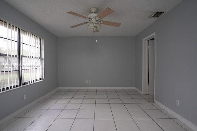 5154 Breckenridge Pl Unit 47, West Palm Beach, FL 33417 - empty room with ceiling fan, a textured ceiling, baseboards, and light tile patterned floors