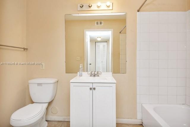 bathroom featuring toilet, shower / bath combination, baseboards, vanity, and tile patterned floors