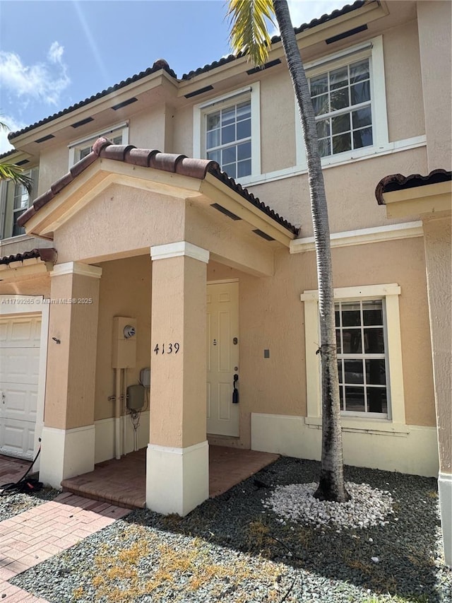 4139 NE 26th St, Homestead, FL 33033 - view of front of home with stucco siding and a tiled roof