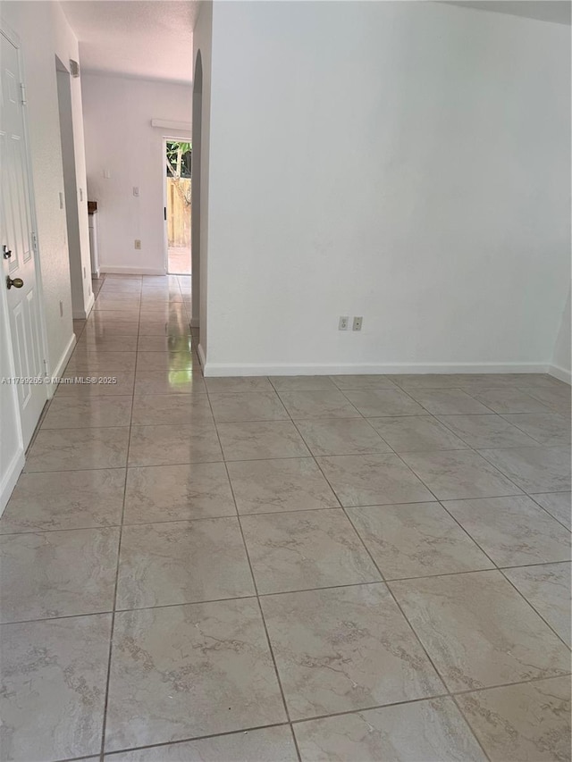 4139 NE 26th St, Homestead, FL 33033 - unfurnished room with baseboards and arched walkways