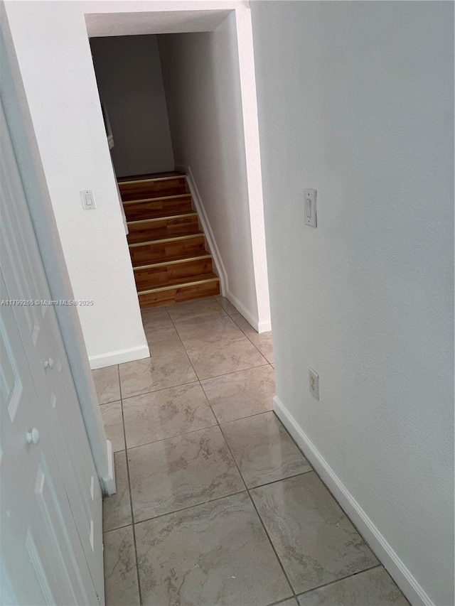 4139 NE 26th St, Homestead, FL 33033 - staircase with marble look tile flooring and baseboards