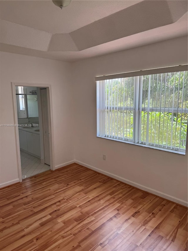 4139 NE 26th St, Homestead, FL 33033 - empty room featuring baseboards and wood finished floors