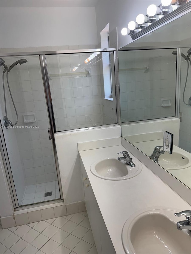 4139 NE 26th St, Homestead, FL 33033 - full bathroom featuring a shower stall, tile patterned flooring, and double vanity