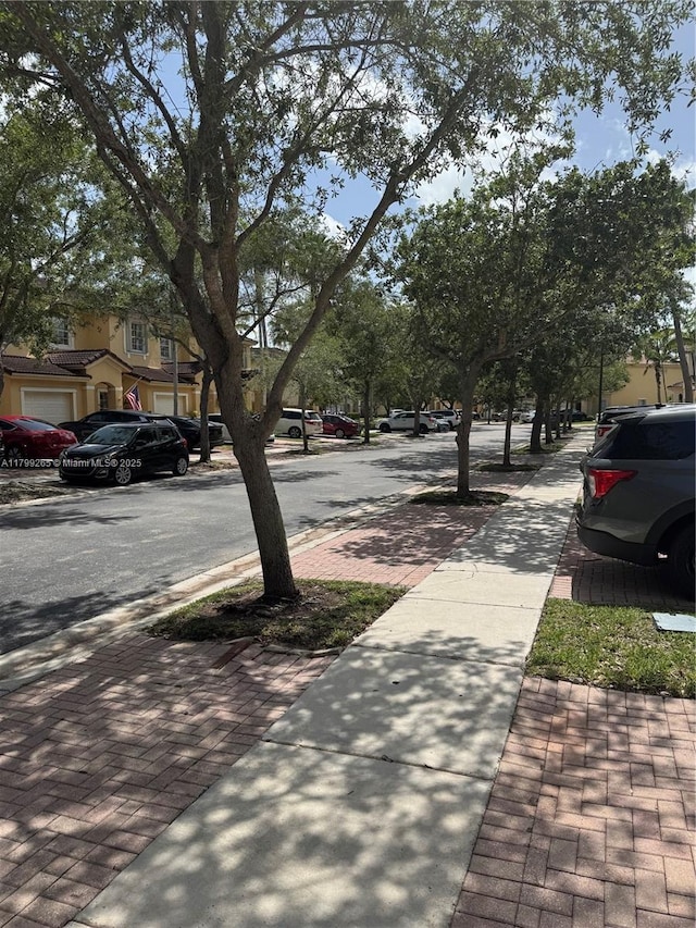 4139 NE 26th St, Homestead, FL 33033 - view of asphalt road with sidewalks and curbs