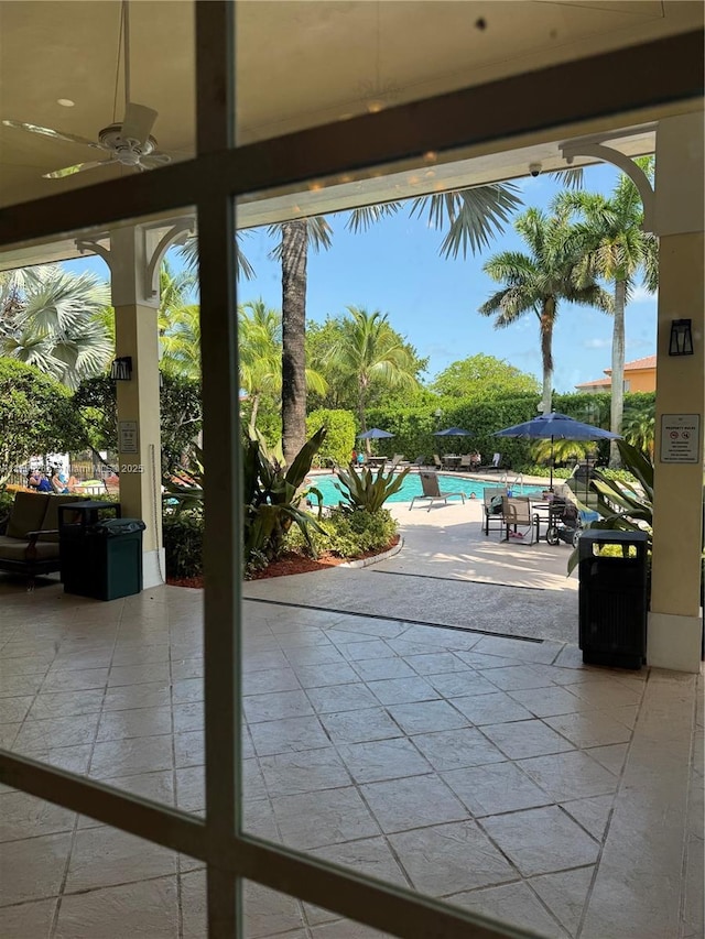 4139 NE 26th St, Homestead, FL 33033 - view of patio with a community pool and a ceiling fan