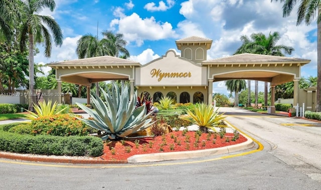 1106 Bahama Bnd Unit D1, Coconut Creek, FL 33066 - view of property featuring asphalt driveway