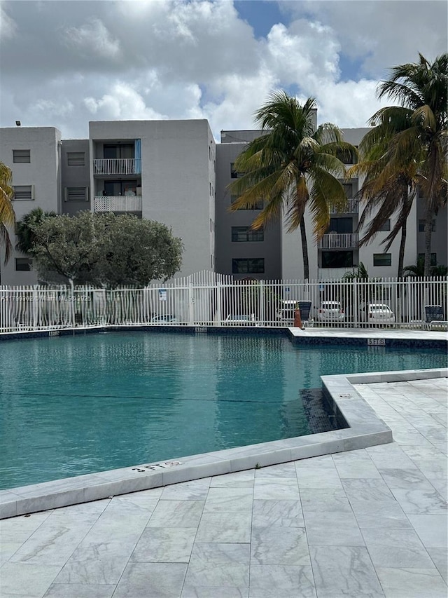 8145 NW 7th St Unit 211, Miami, FL 33126 - community pool with fence and a patio area