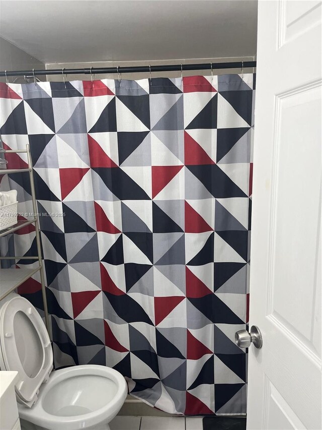 8145 NW 7th St Unit 211, Miami, FL 33126 - full bath with toilet, a shower with curtain, and tile patterned floors