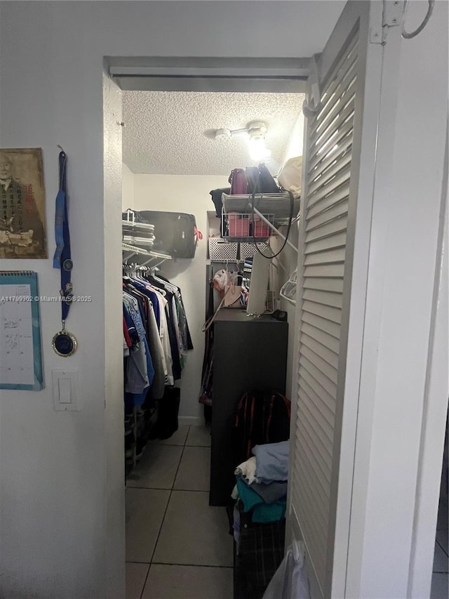 8145 NW 7th St Unit 211, Miami, FL 33126 - spacious closet featuring tile patterned flooring