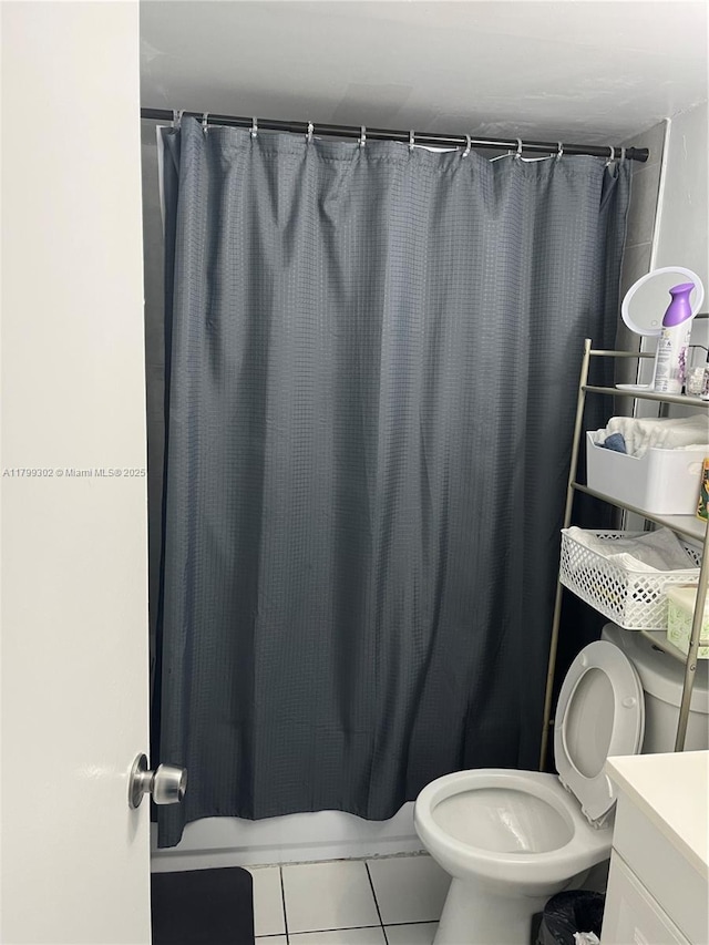 8145 NW 7th St Unit 211, Miami, FL 33126 - bathroom featuring tile patterned floors, toilet, a shower with shower curtain, and vanity