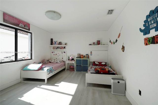 9054 NW 193rd Ter, Hialeah, FL 33018 - bedroom featuring wood finished floors and baseboards