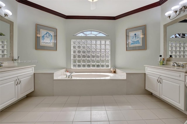 full bathroom with ornamental molding, two vanities, and a bath