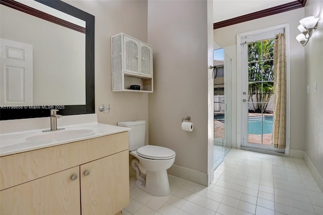 full bath with baseboards, toilet, tile patterned flooring, vanity, and ornamental molding