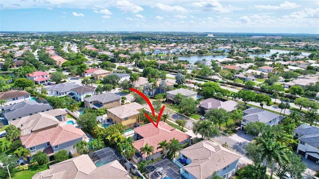 aerial view of residential area with a nearby body of water