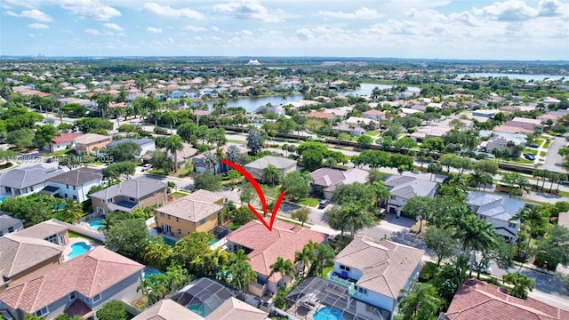 aerial view of residential area with a large body of water