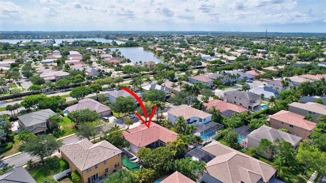 aerial view of residential area with a nearby body of water