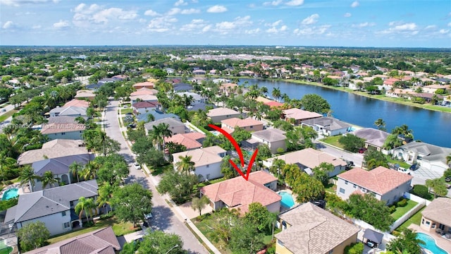 aerial perspective of suburban area featuring a large body of water