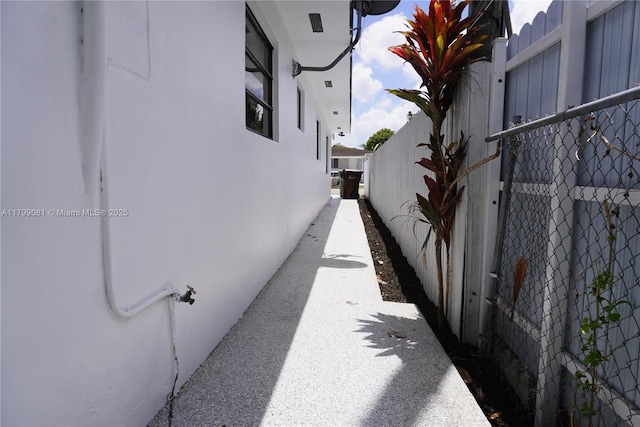 621 E 55th St, Hialeah, FL 33013 - view of side of property with fence and stucco siding