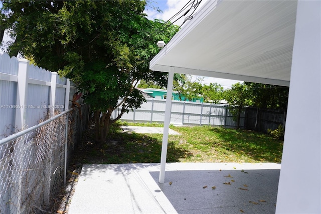fenced backyard featuring a patio