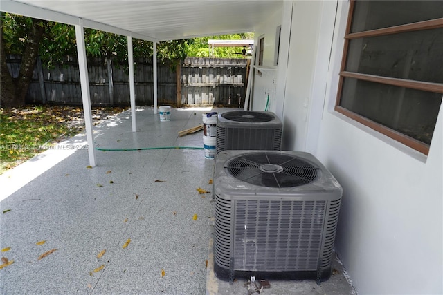 exterior view of cooling unit and fence