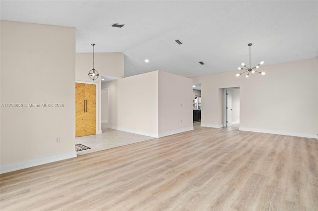 16791 Royal Poinciana Dr, Weston, FL 33326 - unfurnished living room featuring a chandelier, light wood-type flooring, high vaulted ceiling, and baseboards