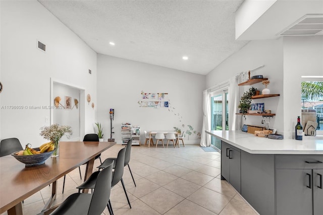 16791 Royal Poinciana Dr, Weston, FL 33326 - kitchen featuring gray cabinets, vaulted ceiling, light countertops, open shelves, and light tile patterned floors